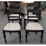 A set of four 19th century Anglo-Indian ebony dining chairs, with reeded frames and supports,