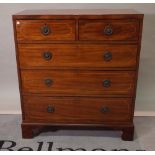 A George III inlaid mahogany chest of two short and three long graduated drawers on bracket feet,