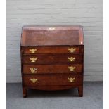 A George III oak bureau, the fitted interior over four long graduated drawers, on bracket feet,
