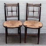 A set of six William Morris design stained beech rush seat side chairs, on turned supports,
