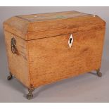 A Regency inlaid mahogany rectangular tea caddy with metal claw feet, 19cm wide x 16cm high.