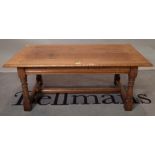 A 20th century oak rectangular coffee table on block supports, 107cm wide x 43cm high.