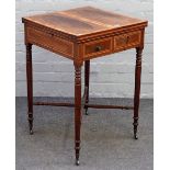 A late George III inlaid mahogany card table, the fold out square top above opposing frieze drawers,