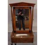 A late Victorian walnut toilet mirror with two drawer base on bracket feet,