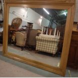 An early 20th century pine rectangular wall mirror, 167cm wide x 141cm high.