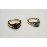 A gold and platinum, diamond set single stone ring,