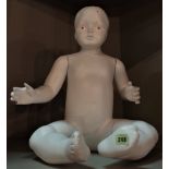 A modern white shop mannequin formed as a baby, 49cm high.
