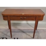 A late George III mahogany foldover card table with single drawer on tapering square supports,