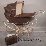 A mid-20th century 'Wilson' silver cross type childs pram, 130cm long x 40cm wide.