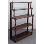 A Victorian mahogany five tier waterfall open bookcase, on barleytwist supports,