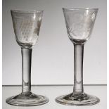 Two plain-stemmed wine glasses, mid-18th century, each with rounded funnel bowls,