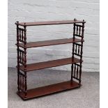 A set of 19th century mahogany hanging open four tier wall shelves, on turned supports,