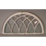 A late 18th century white painted and glazed demi-lune dome arch, 107cm wide x 57cm high.