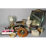 Collectables in a brass anniversary style clock with dome, marble bust, postal scales,