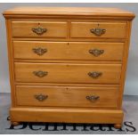 An early 20th century cherrywood chest with two short and three long drawers on bun feet,