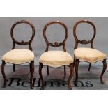 A set of six 19th century walnut balloon back dining chairs on cabriole supports, (6).