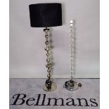 A modern floorstanding glass standard lamp on bobbin turned column and chrome base, 113cm high,