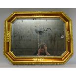 A modern gilt framed canted rectangular wall mirror, 68cm wide x 87cm high.