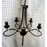 A modern bronzed metal five branch chandelier, with two matching wall lights,