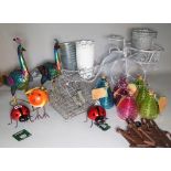 A group of 20th century decorative garden items, including metal peacocks, wasp catchers,