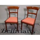 A set of six late Victorian mahogany bar back dining chairs on turned supports,