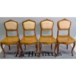 A set of four Louis XV style walnut parcel gilt chairs, 42cm wide x 88cm high, (4).