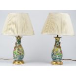 A pair of 20th century Chinese porcelain table lamps and shades, 48cm high, (2).