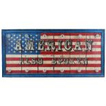A modern hardwood sign with an American flag decoration 'AMERICAN ALSO SPOKEN',