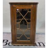 A 19th century mahogany corner cabinet with astragal glazed door, 67cm wide x 102cm high.