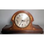 A late Edwardian inlaid mahogany mantel clock, on bun feet, 46cm wide x 20cm high.