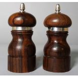 A pair of modern silver mounted hardwood pepperettes, 11cm high, (2).