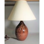 A 20th century studio pottery table lamp, 70cm high.