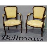 A pair of Louis XVI style stained beech open armchairs, 55cm wide x 87cm high, (2).