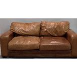 A modern brown leather sofa on block feet, 200cm wide.