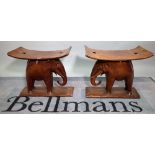 A pair of 20th century elephant carved Ashanti stools, 54cm wide x 48cm high, (2).