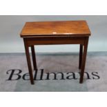 A late 18th century mahogany fold over tea table, 73cm wide x 71cm high.