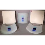 A pair of modern cream geometric panel wall lights, 29cm x 29cm, and six curved glass wall lights,