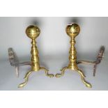 A pair of early 20th century brass and cast iron andirons, 42cm high, (2).