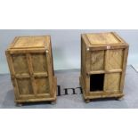 A pair of early 20th century hardwood bedside cupboards with panelled doors on bun feet, (a.f.