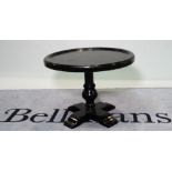 A mid-20th century ebonised oak low table with circular dished top, 63cm diameter x 48cm high.