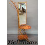 A mid-20th century yellow painted two tier mirrored hall stand, 56cm wide x 163cm high.