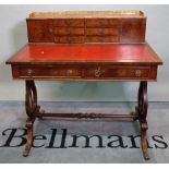 A Regency style mahogany two drawer desk, on dual ended lyre supports, 92cm wide x 93cm high.