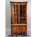 A Regency style mahogany concave corner display cabinet, 91cm wide x 188cm high.