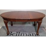 A late Victorian mahogany oval dining table on ball and claw supports, 166cm long x 76cm high.