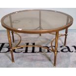 A mid-20th century brass and circular glass coffee table, 77cm diameter x 40cm high.