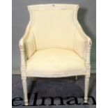 A white painted French style armchair on turned supports, 65cm wide x 96cm high.