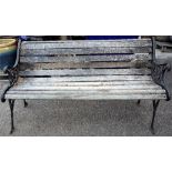 An early 20th century cast iron slatted garden bench, 121cm wide x 76cm high.