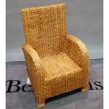 A mid-20th century rattan weave armchair, 62cm wide x 95cm high.