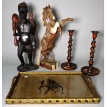 A hardwood figure of a horse, 48cm high, and another hardwood figure of a man , 51cm high,