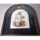 A late 19th century German porcelain plaque of a young girl within a ormolu mounted mahogany